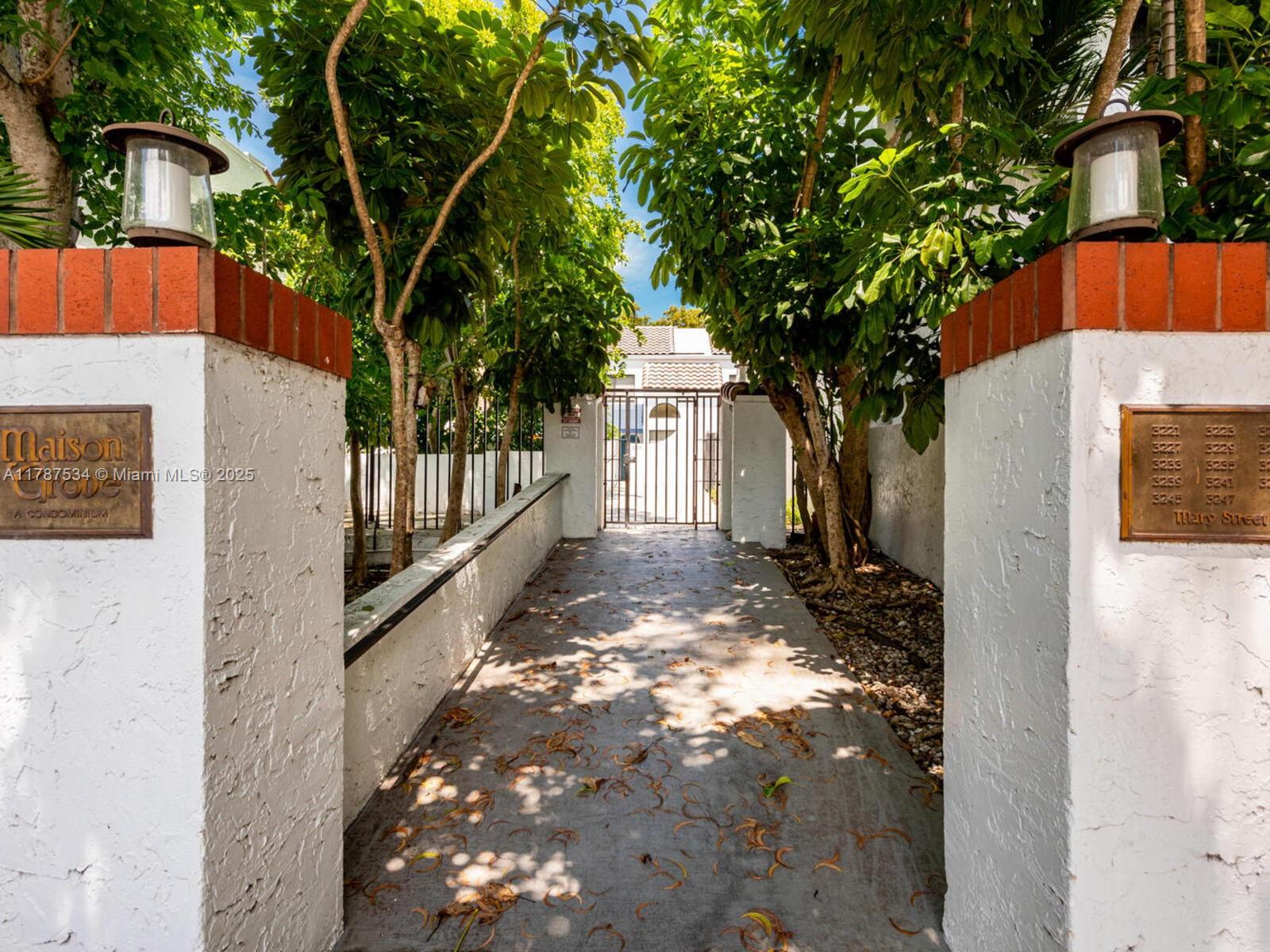3229 Mary Street, Unit 2 Miami, FL 33133 - Photo 2 of 56 a view of a house with a small yard