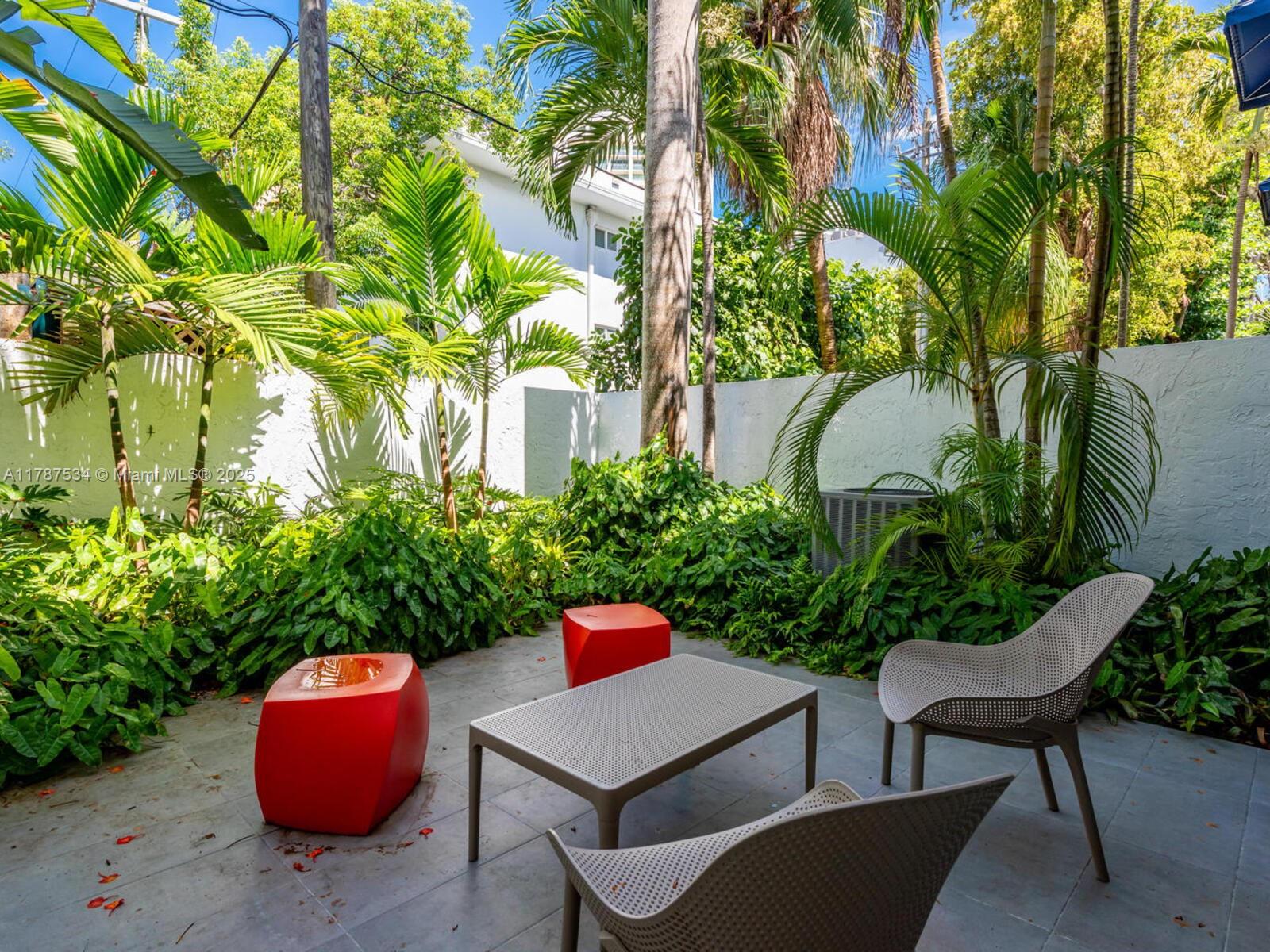 3229 Mary Street, Unit 2 Miami, FL 33133 - Photo 29 of 56 a backyard of a house with outdoor seating