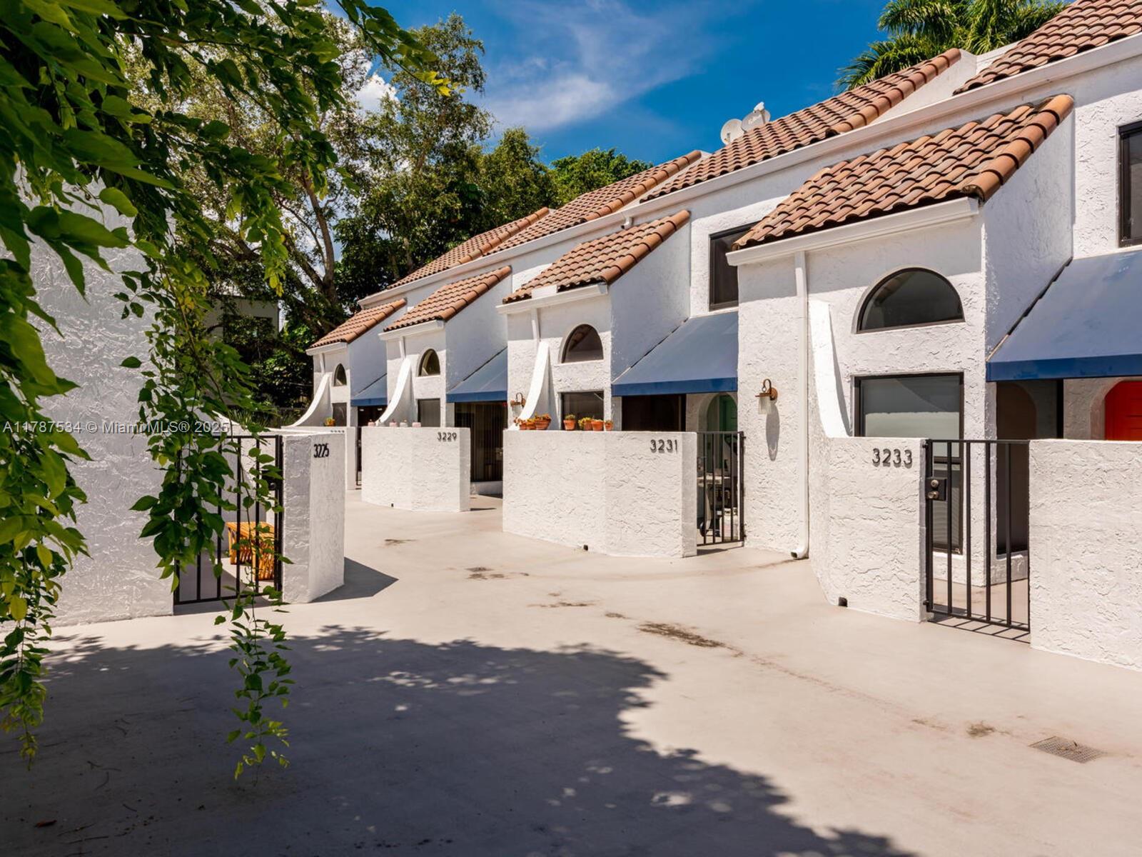 3229 Mary Street, Unit 2 Miami, FL 33133 - Photo 3 of 56 a front view of a large white building