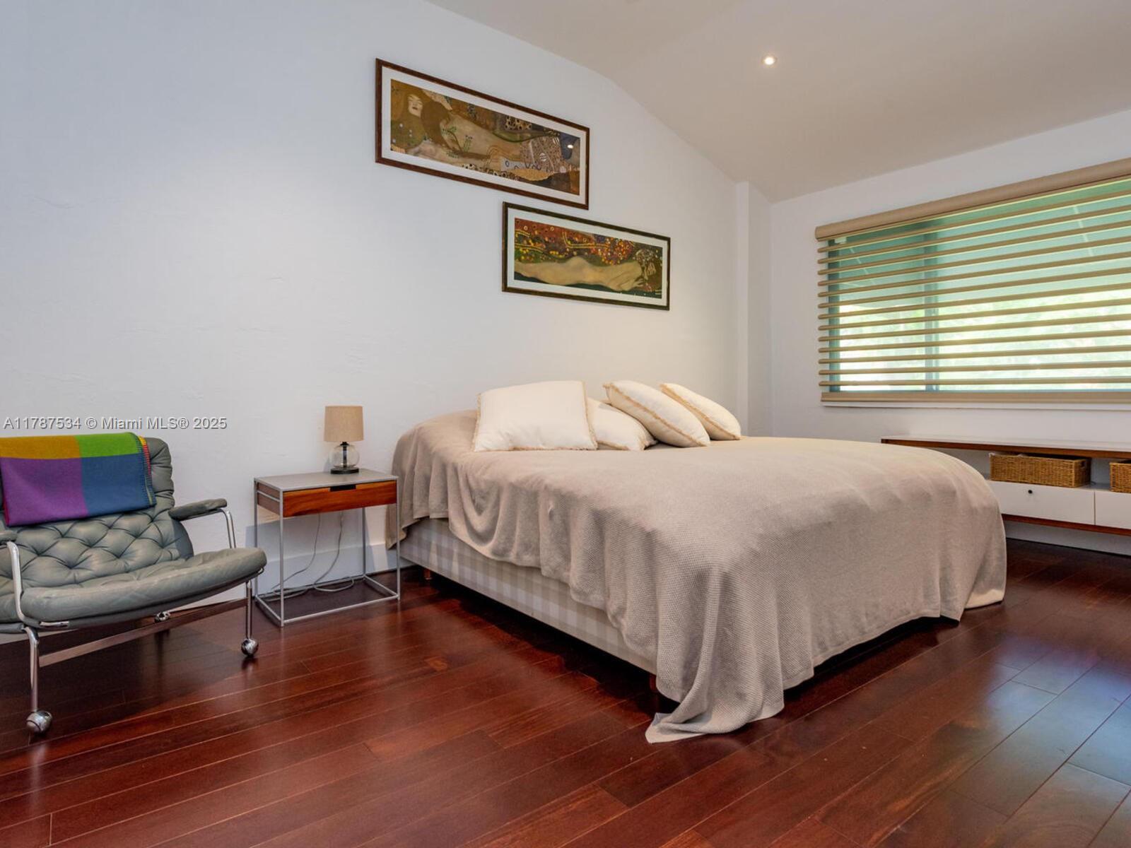 3229 Mary Street, Unit 2 Miami, FL 33133 - Photo 49 of 56 a bedroom with a bed and a couch