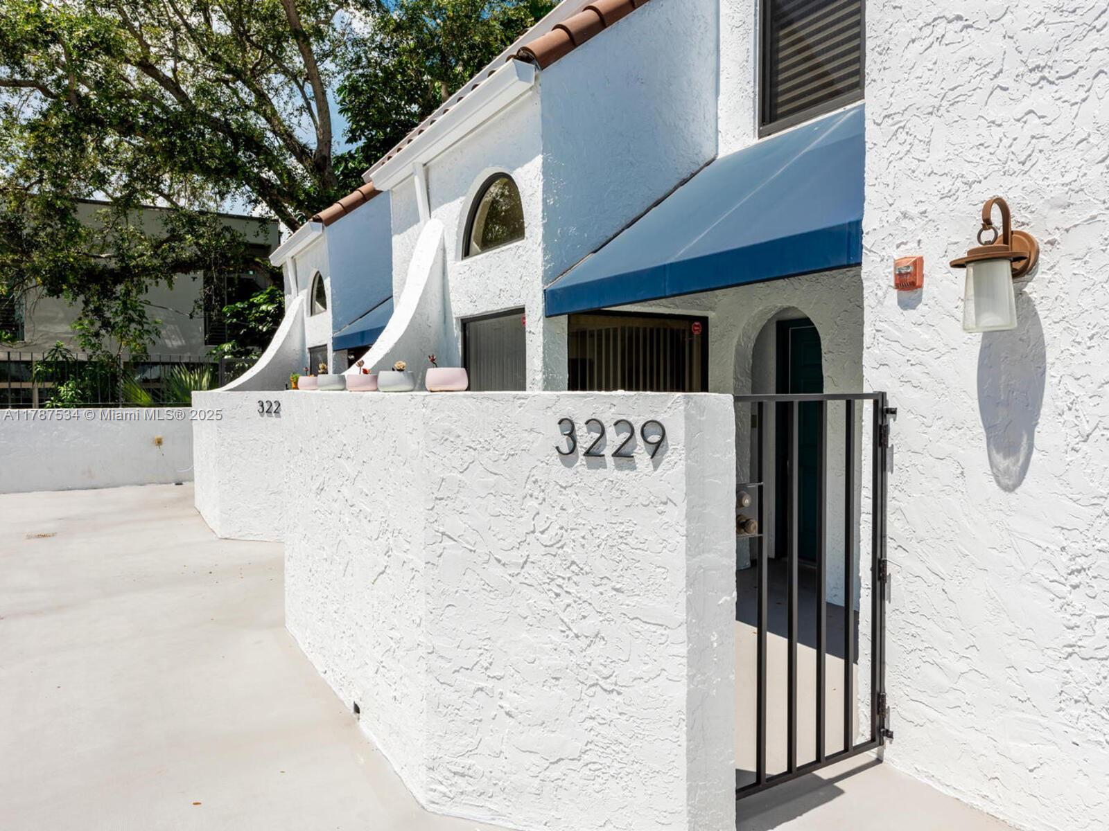 3229 Mary Street, Unit 2 Miami, FL 33133 - Photo 5 of 56 a view of a back yard of the building