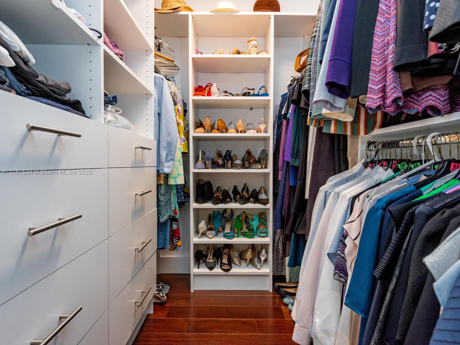 3229 Mary Street, Unit 2 Miami, FL 33133 - Photo 55 of 56 a view of walk in closet with clothes and shoes
