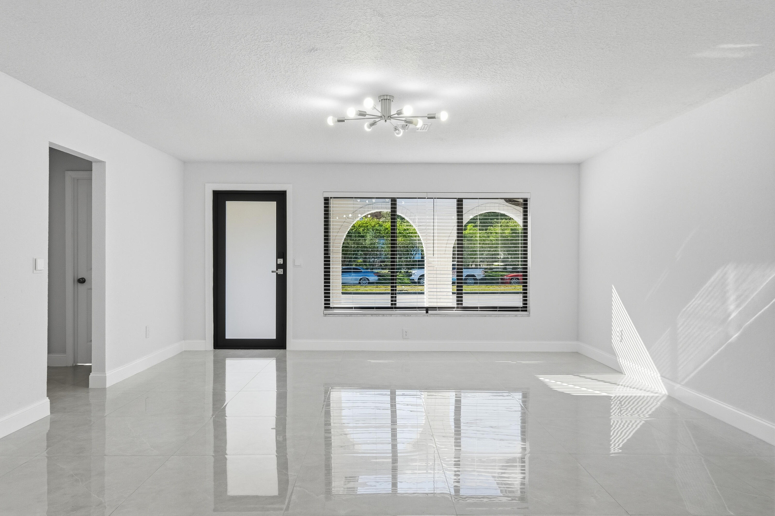 22390 Southwest 66th Avenue Boca Raton, FL 33428 - Photo 12 of 58 a view of an empty room with a window