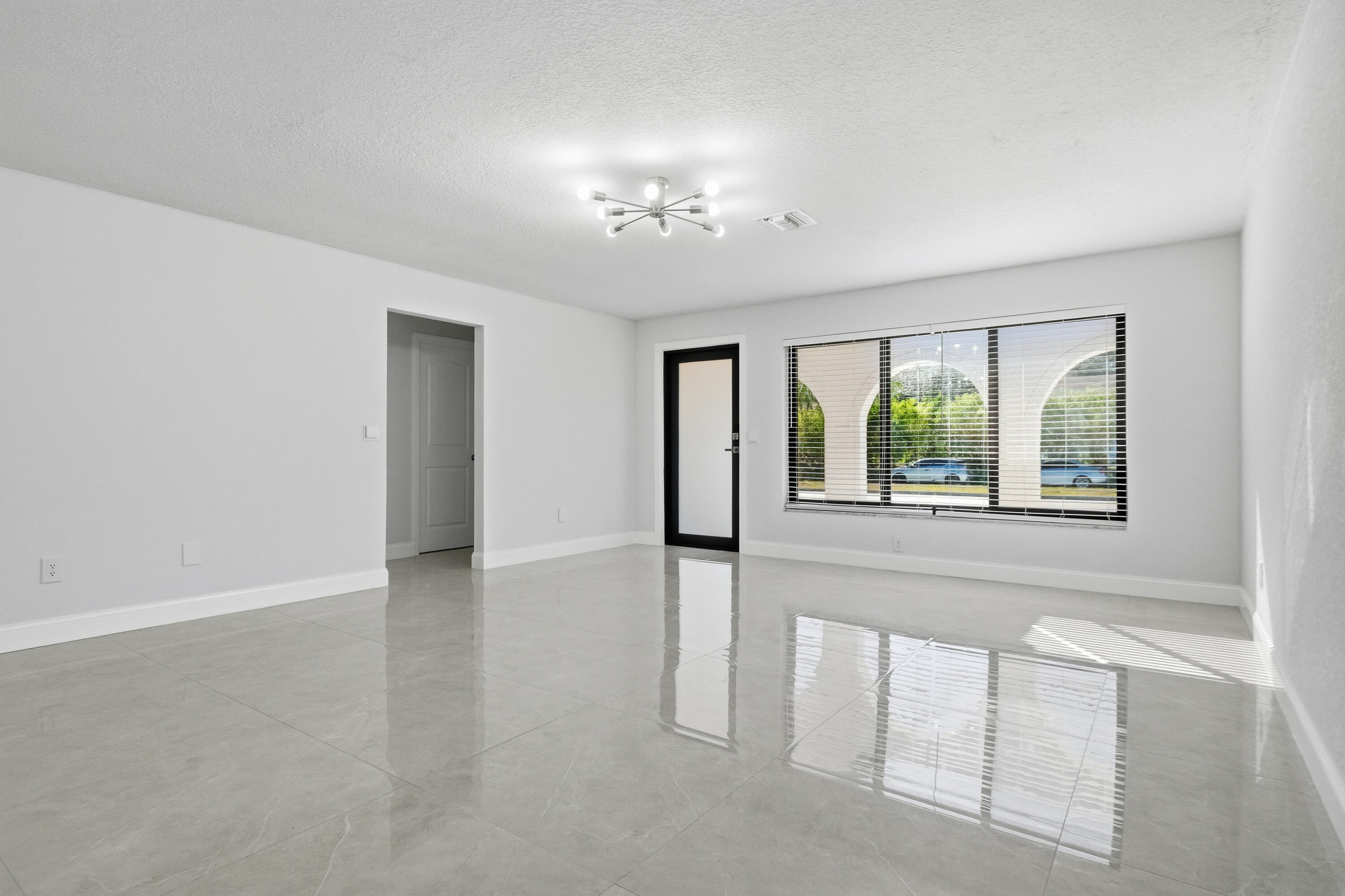 22390 Southwest 66th Avenue Boca Raton, FL 33428 - Photo 13 of 58 a view of an empty room with a window