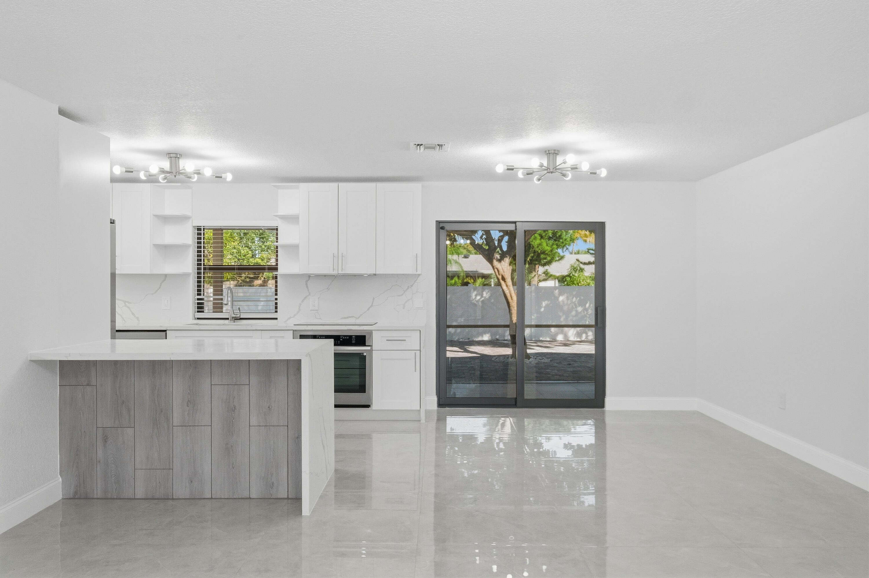 22390 Southwest 66th Avenue Boca Raton, FL 33428 - Photo 14 of 58 a view of kitchen with furniture and window