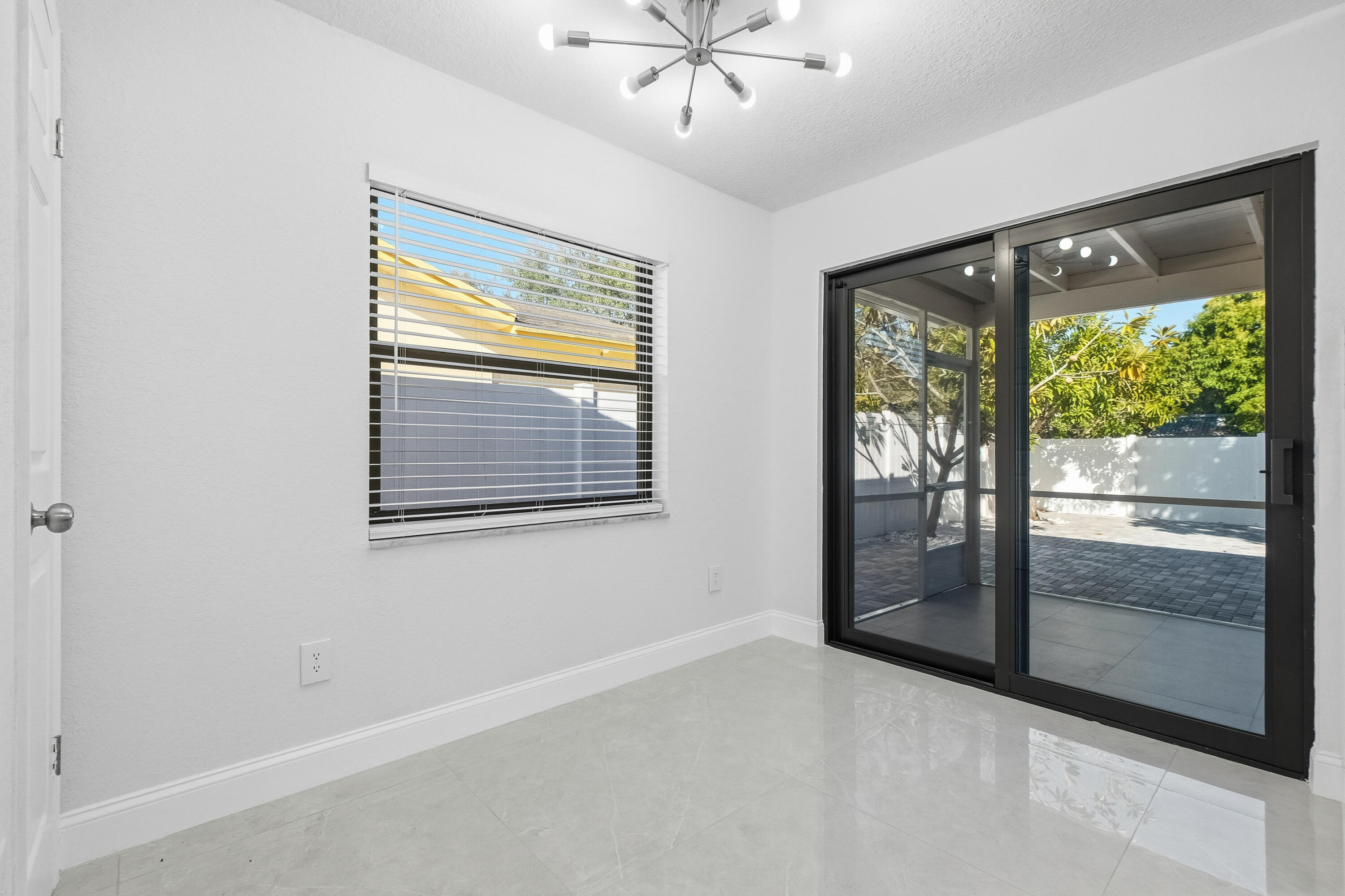 22390 Southwest 66th Avenue Boca Raton, FL 33428 - Photo 26 of 58 a view of an empty room with a window