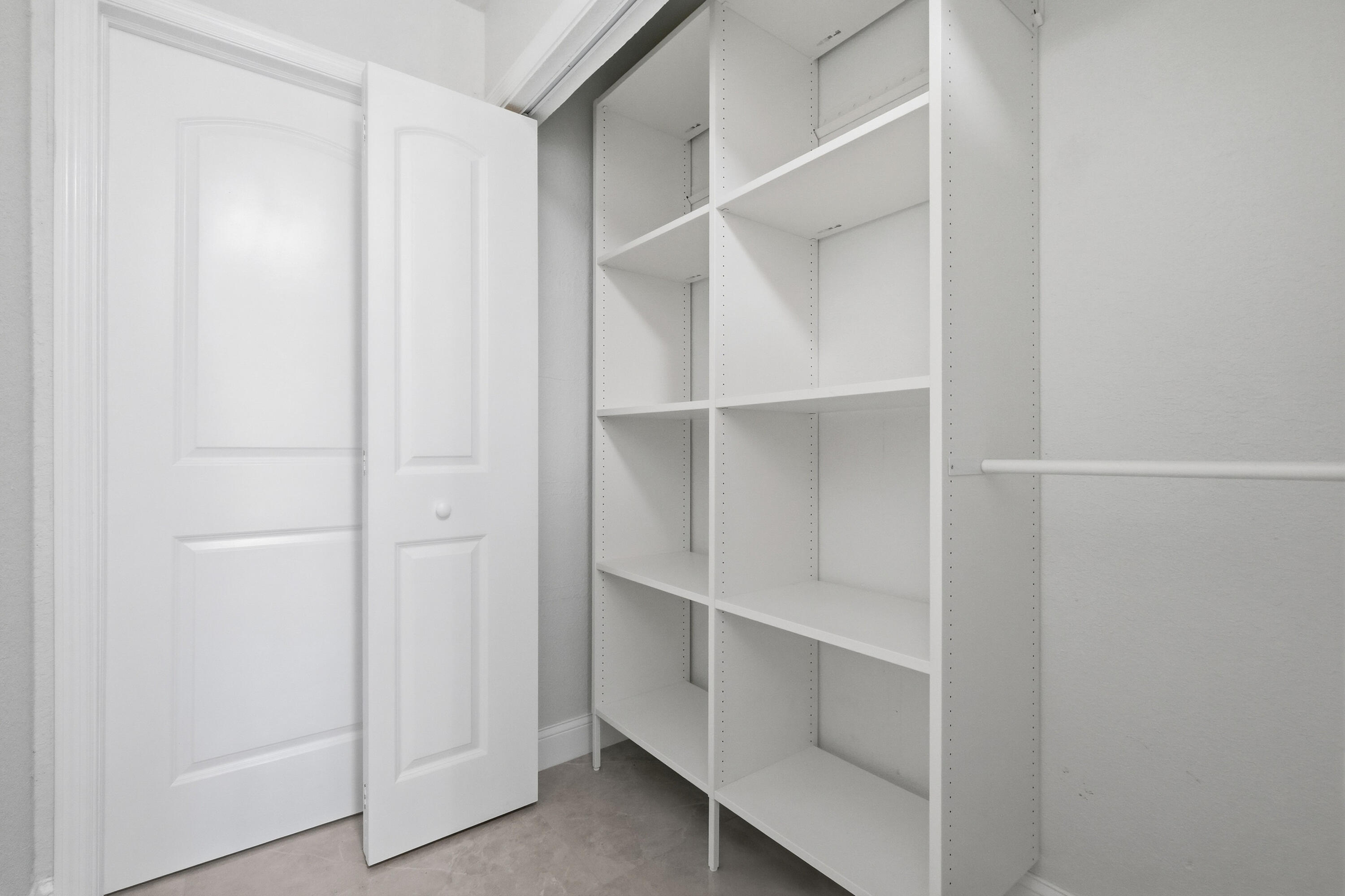 22390 Southwest 66th Avenue Boca Raton, FL 33428 - Photo 30 of 58 a view of an empty walk in closet