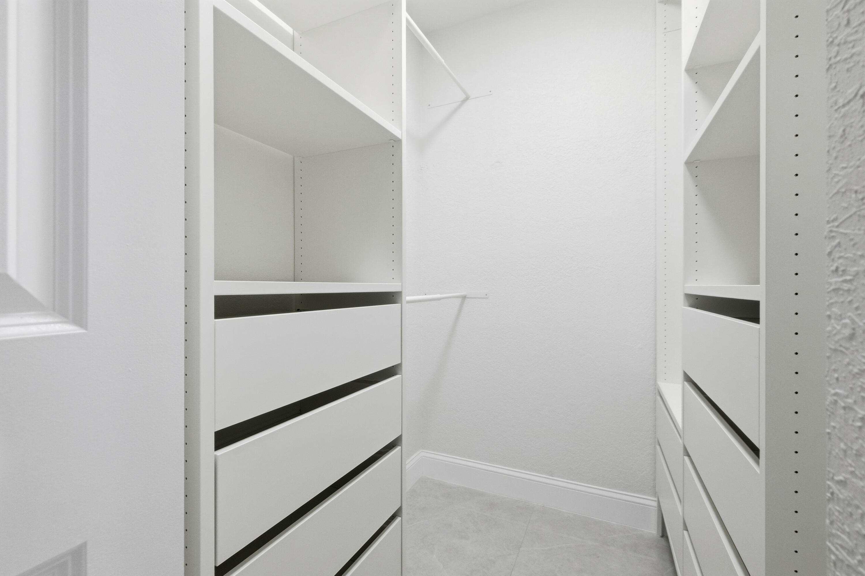 22390 Southwest 66th Avenue Boca Raton, FL 33428 - Photo 31 of 58 a view of an empty walk in closet
