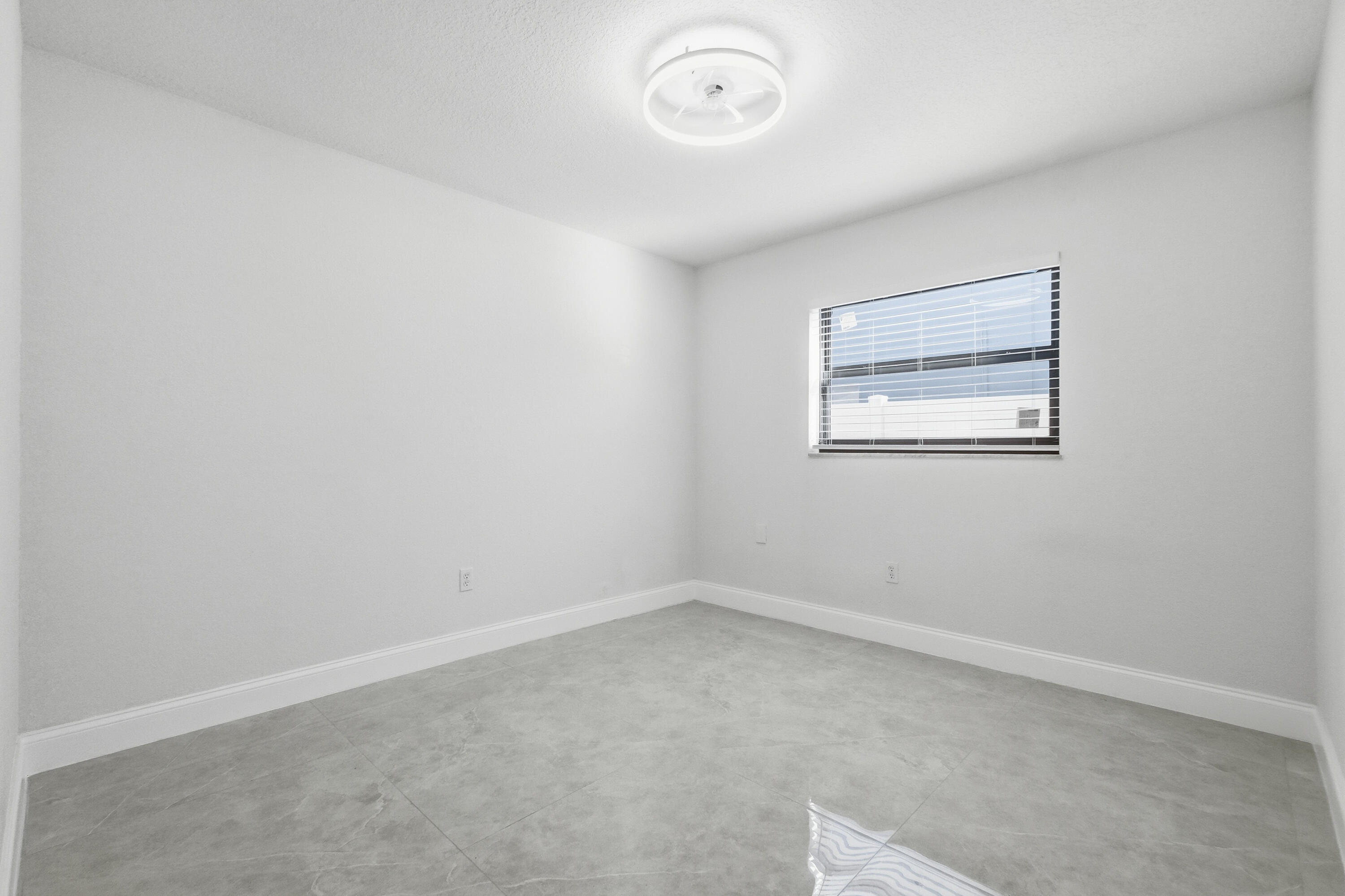 22390 Southwest 66th Avenue Boca Raton, FL 33428 - Photo 33 of 58 an empty room with a window