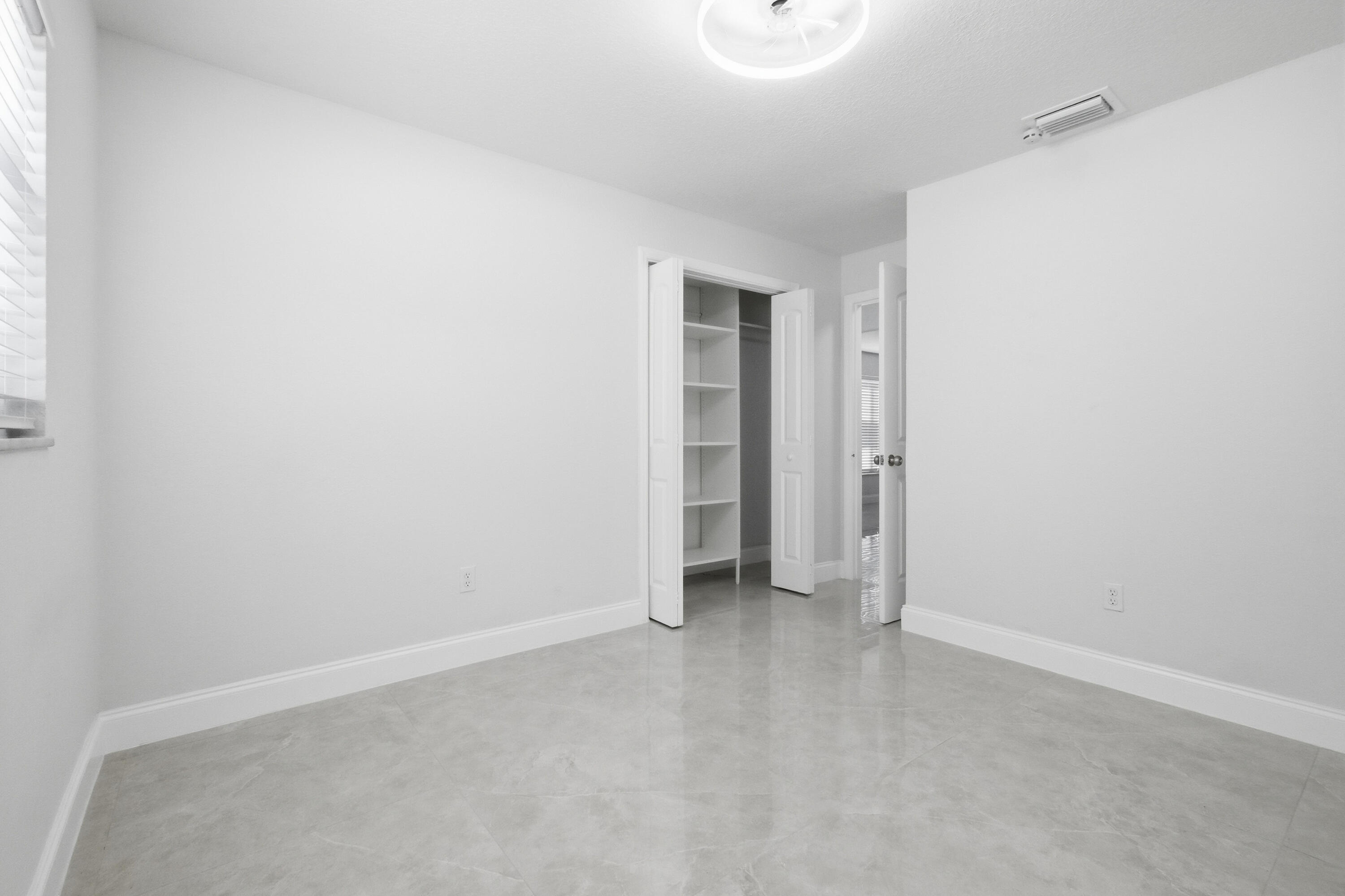 22390 Southwest 66th Avenue Boca Raton, FL 33428 - Photo 34 of 58 a view of an empty room