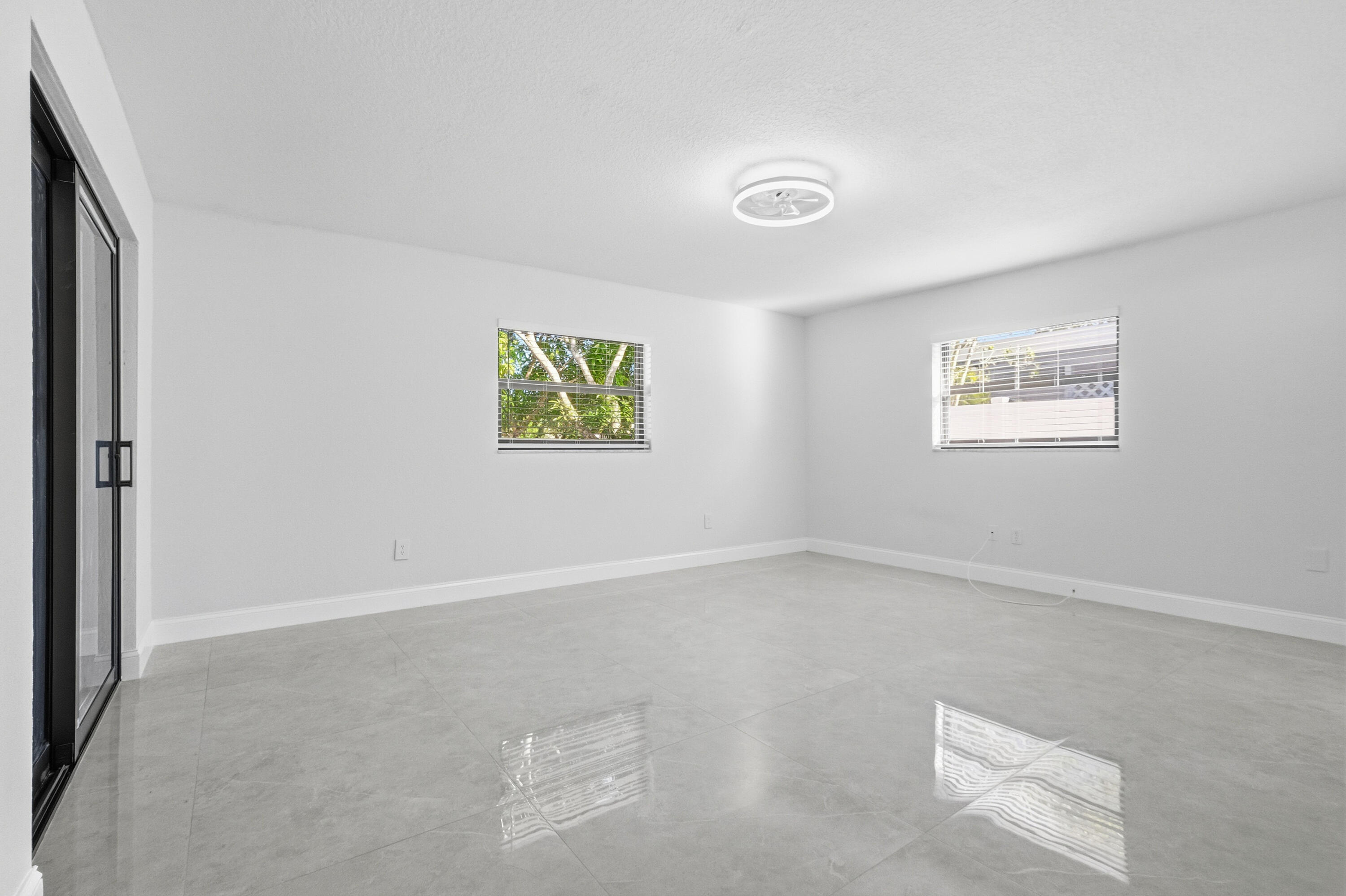 22390 Southwest 66th Avenue Boca Raton, FL 33428 - Photo 35 of 58 an empty room with windows