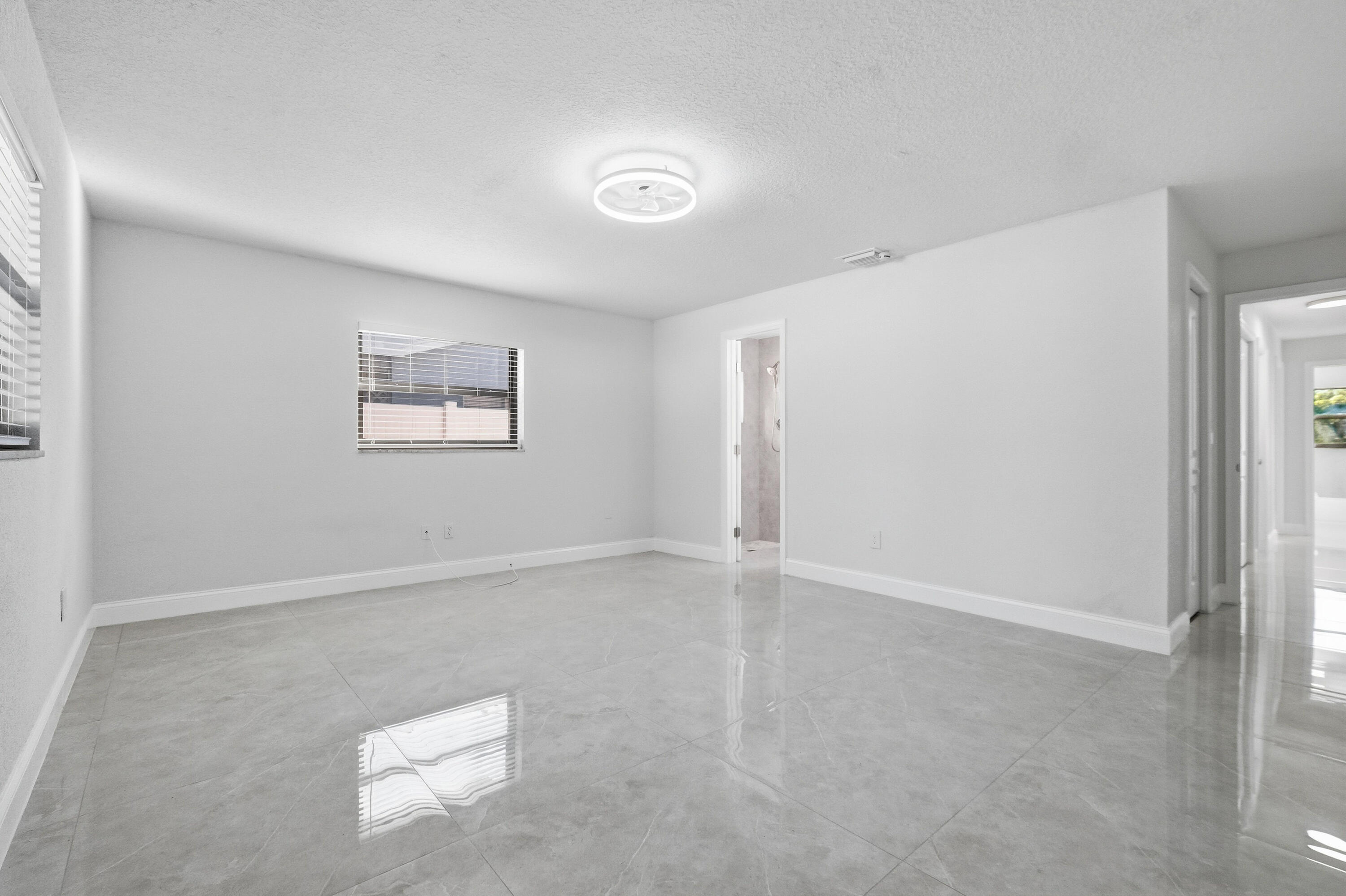 22390 Southwest 66th Avenue Boca Raton, FL 33428 - Photo 36 of 58 an empty room with windows