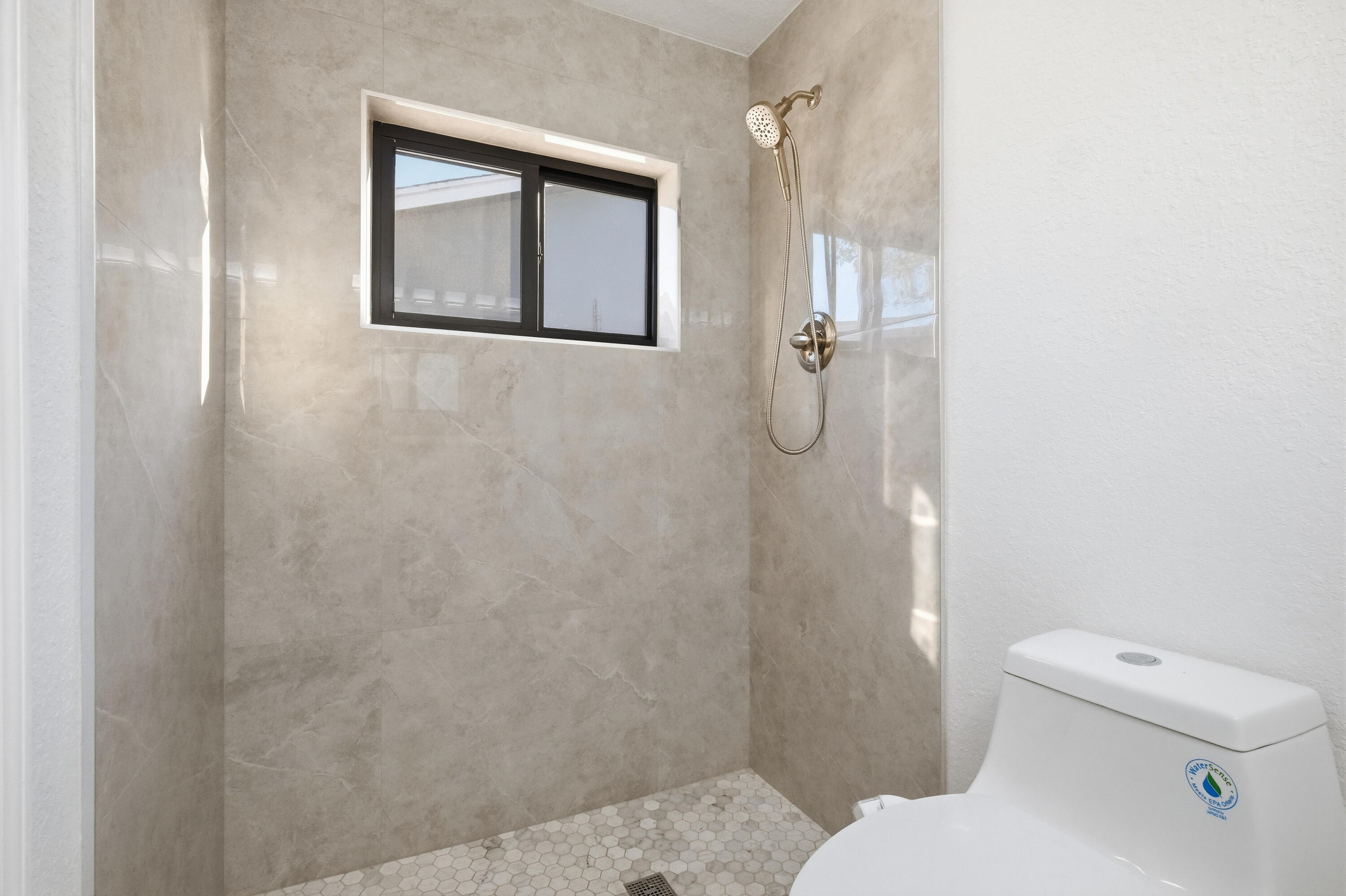 22390 Southwest 66th Avenue Boca Raton, FL 33428 - Photo 39 of 58 a bathroom with a toilet and a shower
