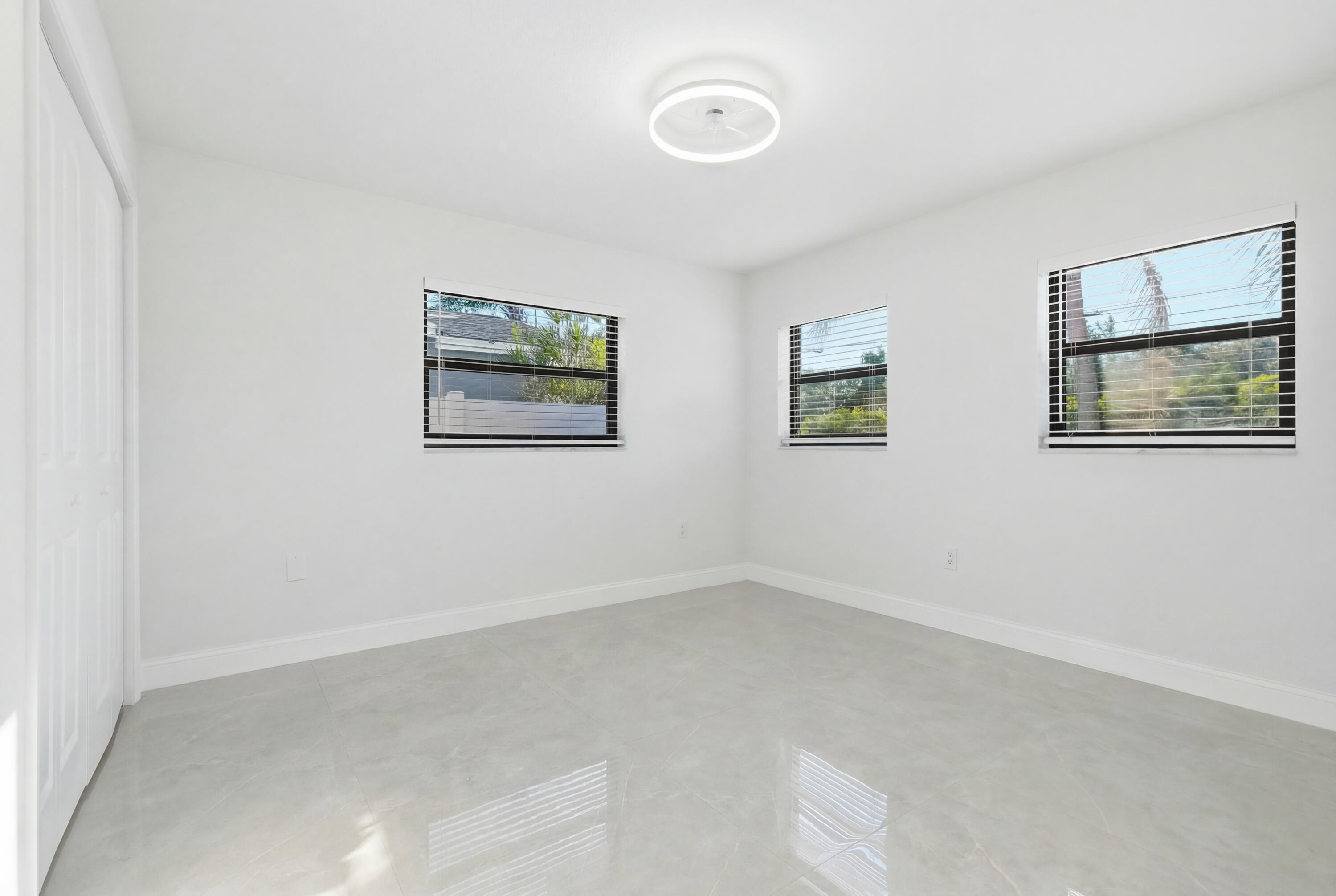 22390 Southwest 66th Avenue Boca Raton, FL 33428 - Photo 40 of 58 an empty room with windows and closet