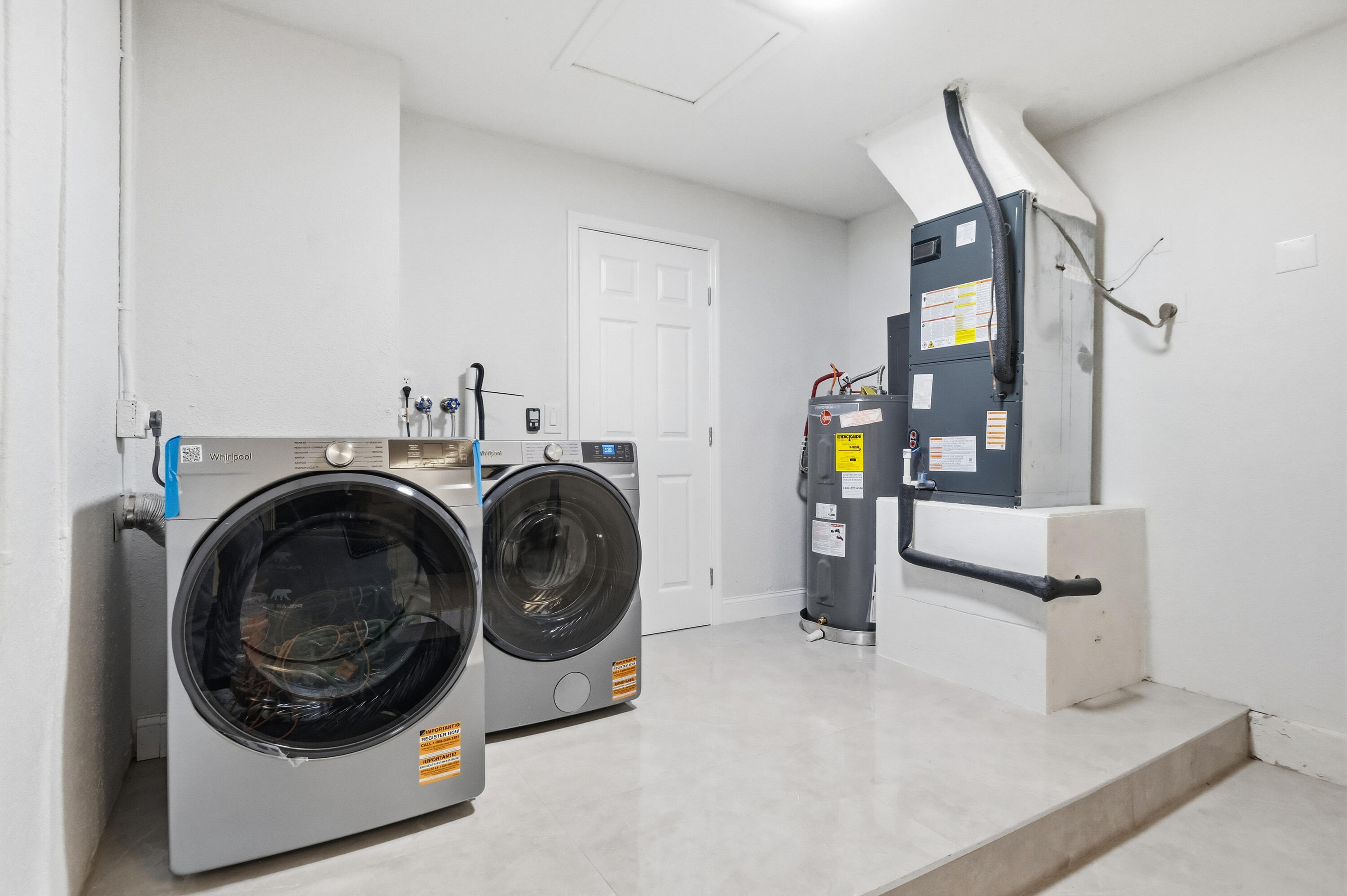 22390 Southwest 66th Avenue Boca Raton, FL 33428 - Photo 43 of 58 a utility room with dryer and washer