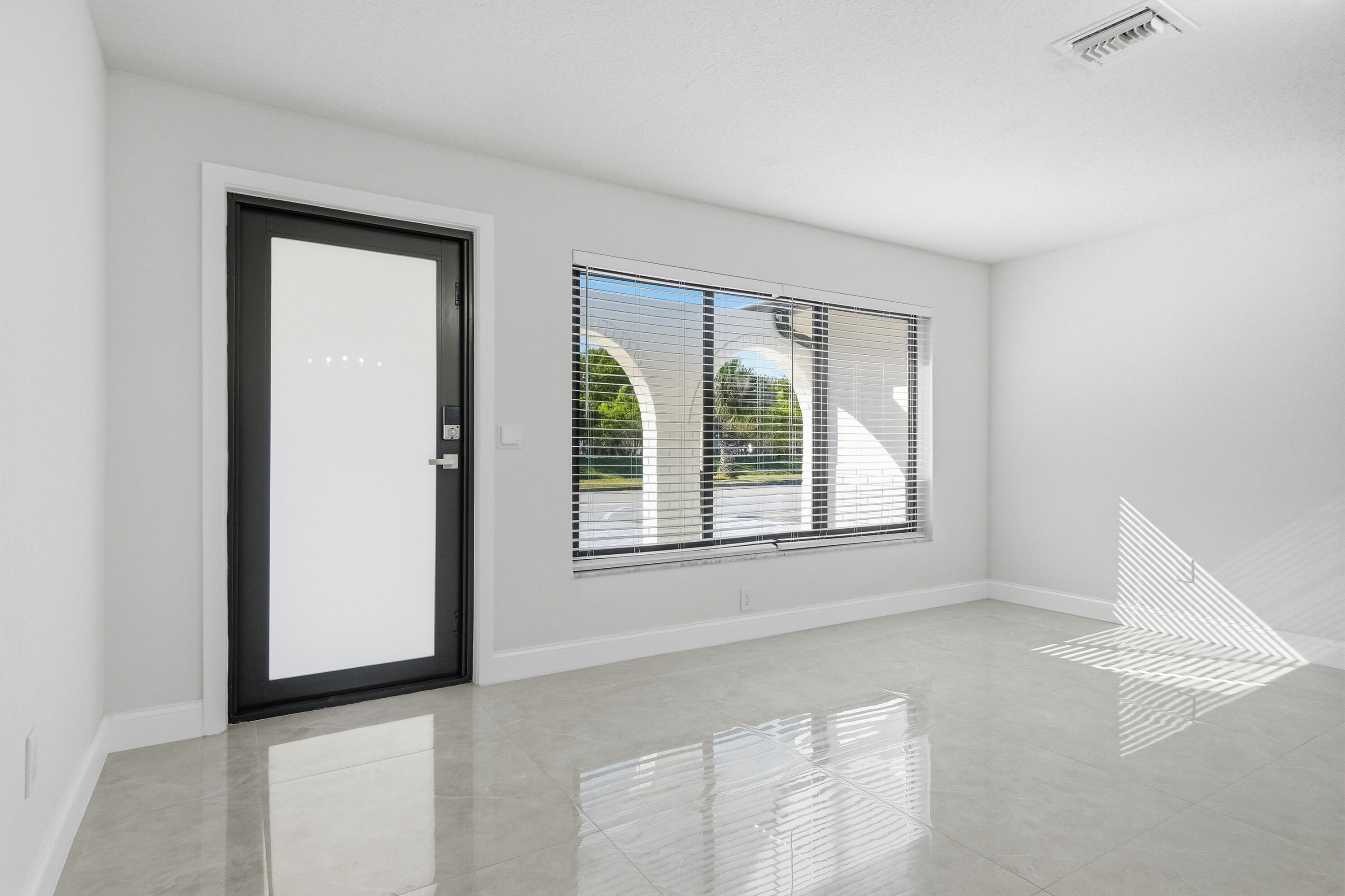 22390 Southwest 66th Avenue Boca Raton, FL 33428 - Photo 9 of 58 an empty room with windows and closet