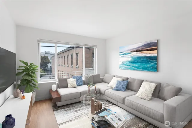 a living room with furniture and a large window