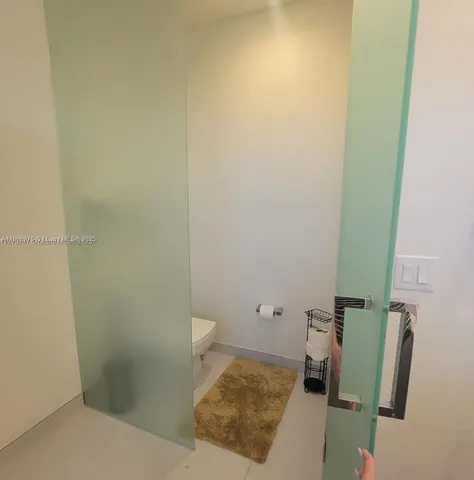 a view of a swimming pool with a seating space