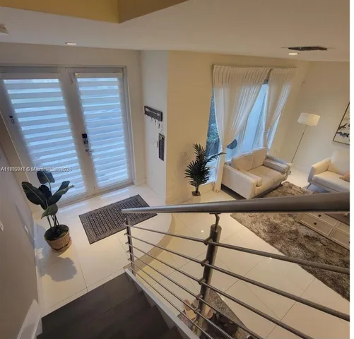a living room with furniture window and a table