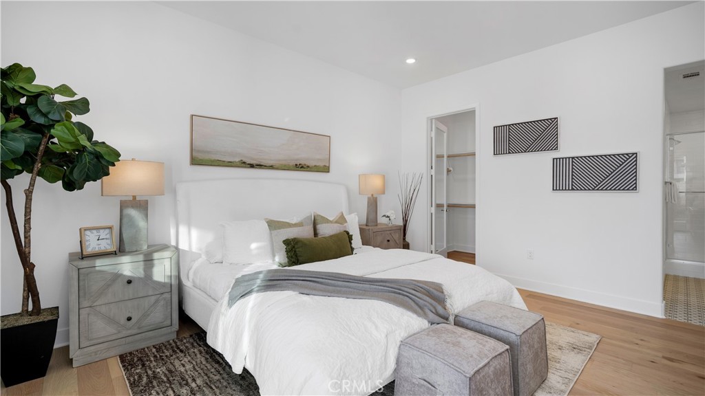 113 Junco Irvine, CA 92618 - Photo 19 of 47 a bedroom with a bed and a potted plant