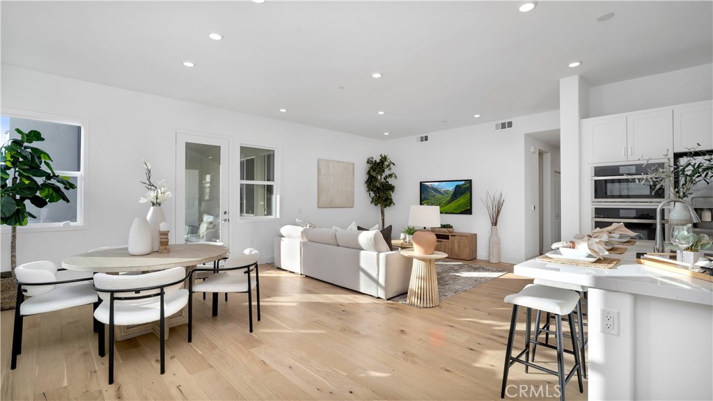 113 Junco Irvine, CA 92618 - Photo 6 of 47 a living room with fireplace furniture and a potted plant