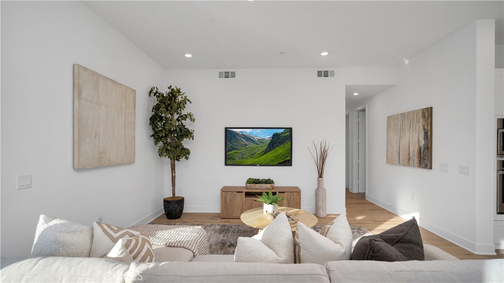 113 Junco Irvine, CA 92618 - Photo 9 of 47 a living room with furniture and a flat screen tv