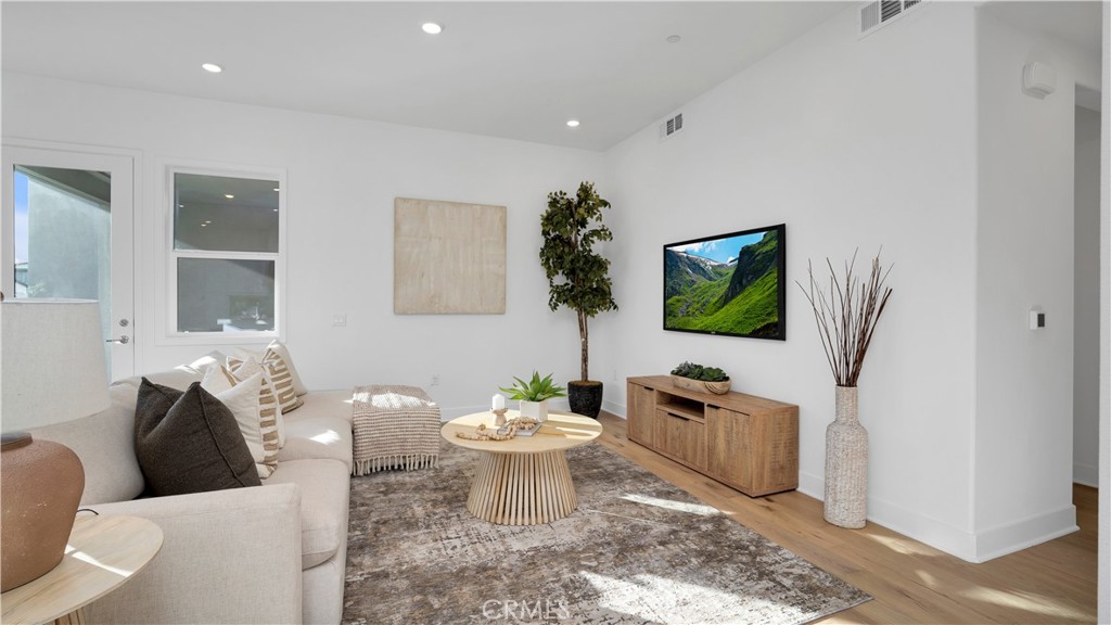 113 Junco Irvine, CA 92618 - Photo 10 of 47 a living room with furniture and a flat screen tv