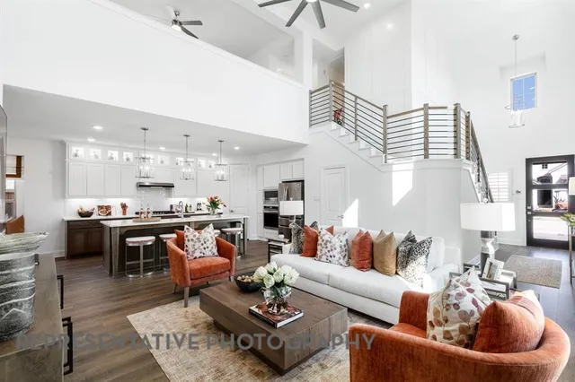 a living room with furniture kitchen view and a table