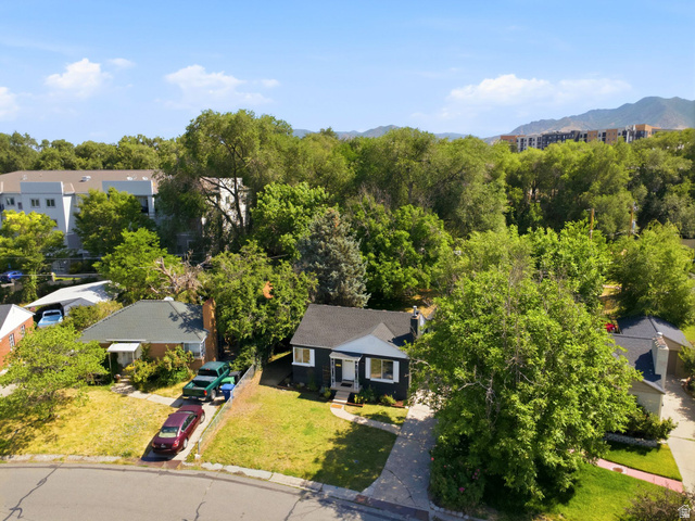 1187 East Ridgedale Circle Millcreek, UT 84106 - Photo 36 of 49 Single-story residence with a dark exterior and white trim, featuring a symmetrical facade