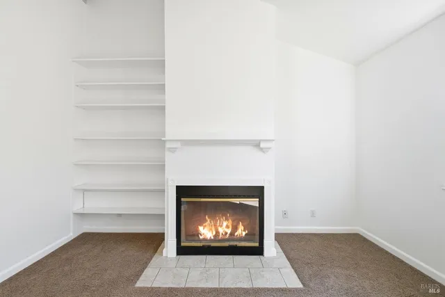 a living room with a fireplace