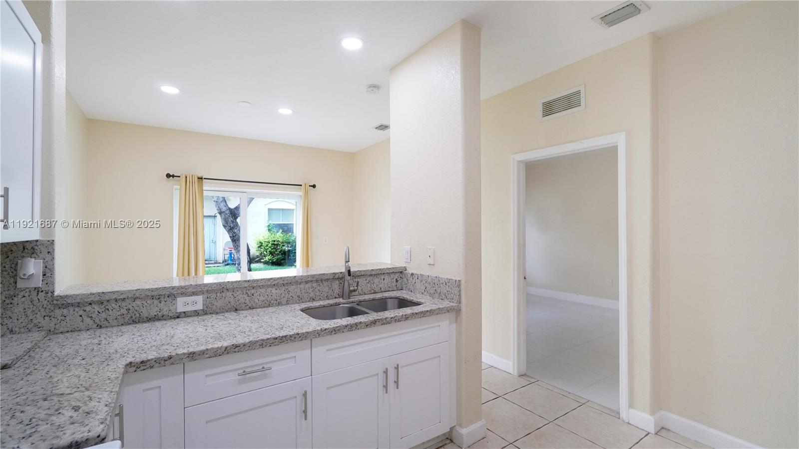 1535 Southeast 26th Street, Unit 103 Homestead, FL 33035 - Photo 18 of 26 a bathroom with a sink and a mirror