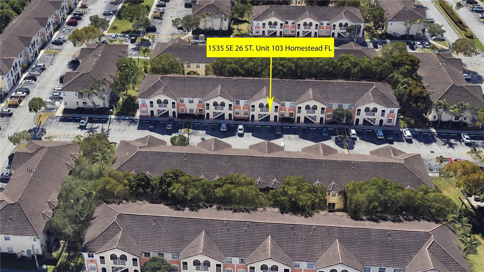 1535 Southeast 26th Street, Unit 103 Homestead, FL 33035 - Photo 25 of 26 an aerial view of a tennis ground and swimming pool