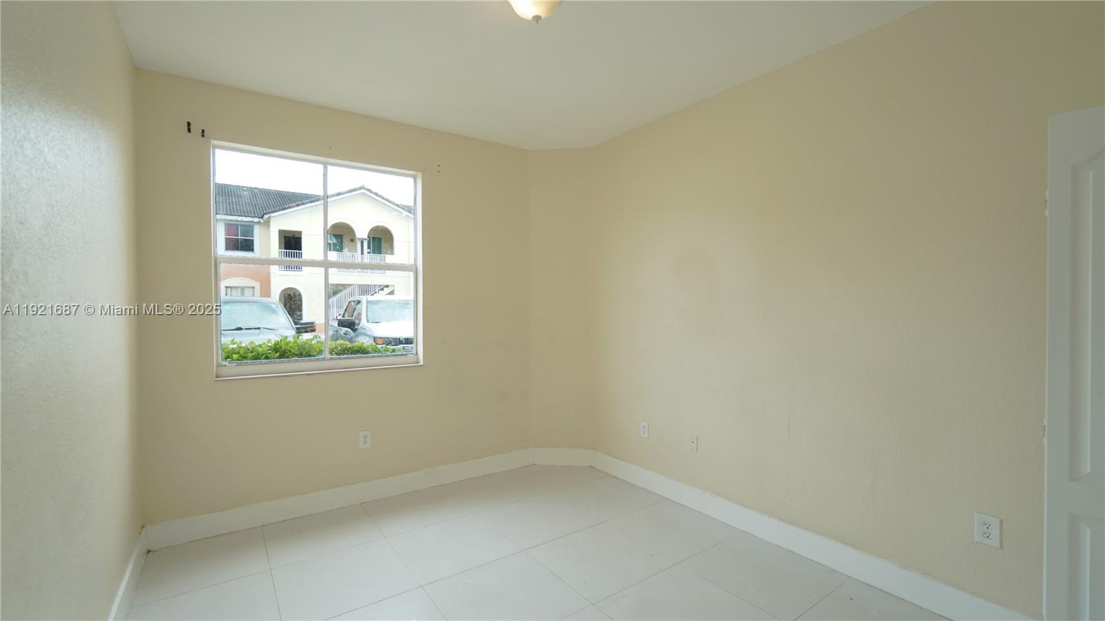 1535 Southeast 26th Street, Unit 103 Homestead, FL 33035 - Photo 8 of 26 a small space with a window
