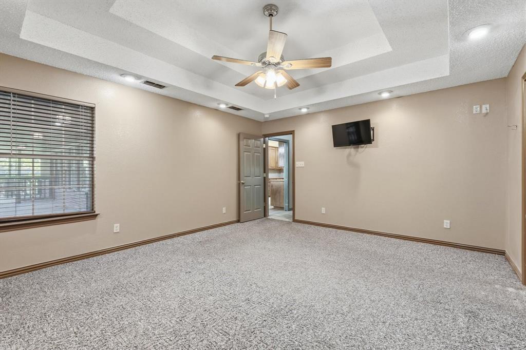 135 Private Road 2202 Decatur, TX 76234 - Photo 15 of 40 Unfurnished room with a ceiling fan, carpet, and recessed lighting