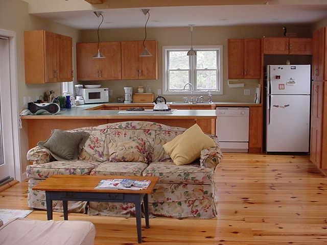 29 Fishermans Road Truro, MA 02666 - Photo 4 of 24 a living room with furniture and kitchen area