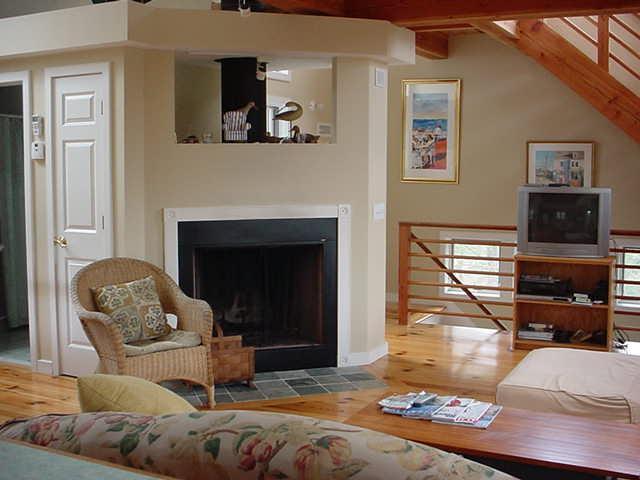 29 Fishermans Road Truro, MA 02666 - Photo 8 of 24 a living room with furniture and a fireplace