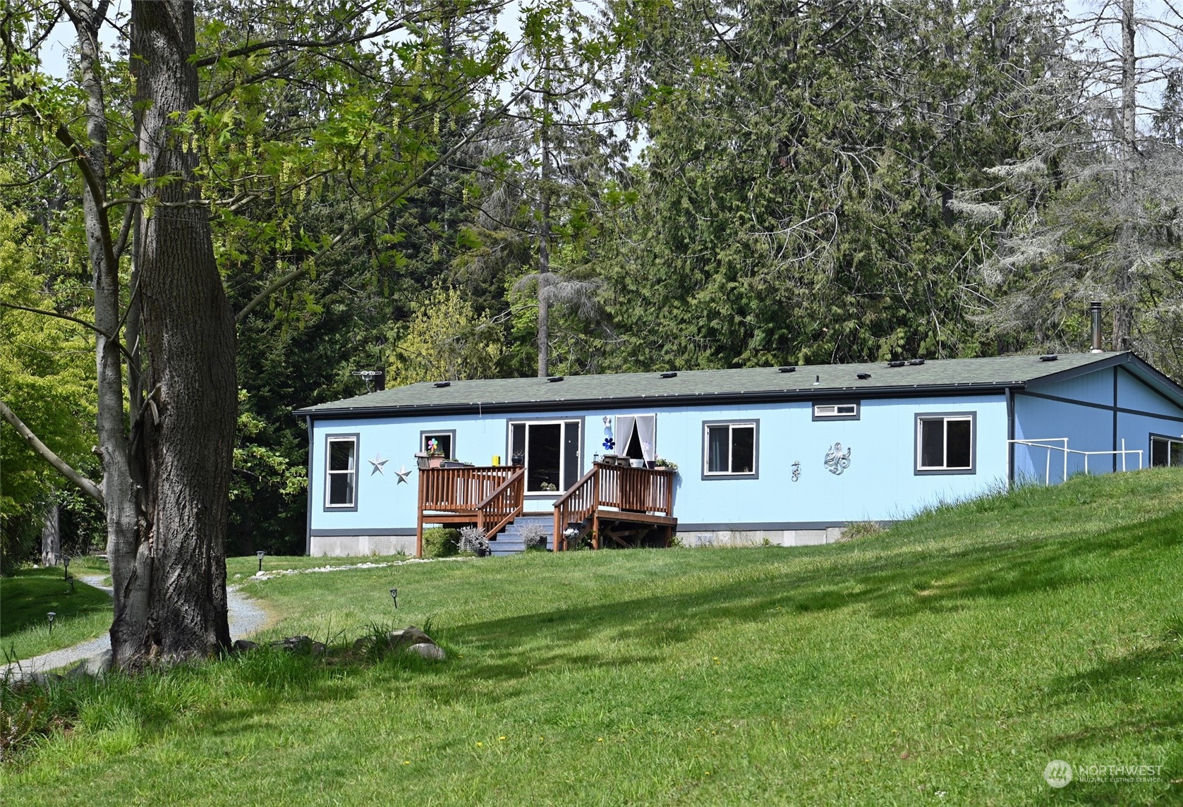 6612 Wahl Road Freeland, WA 98249 - Photo 1 of 24 a house view with a backyard space