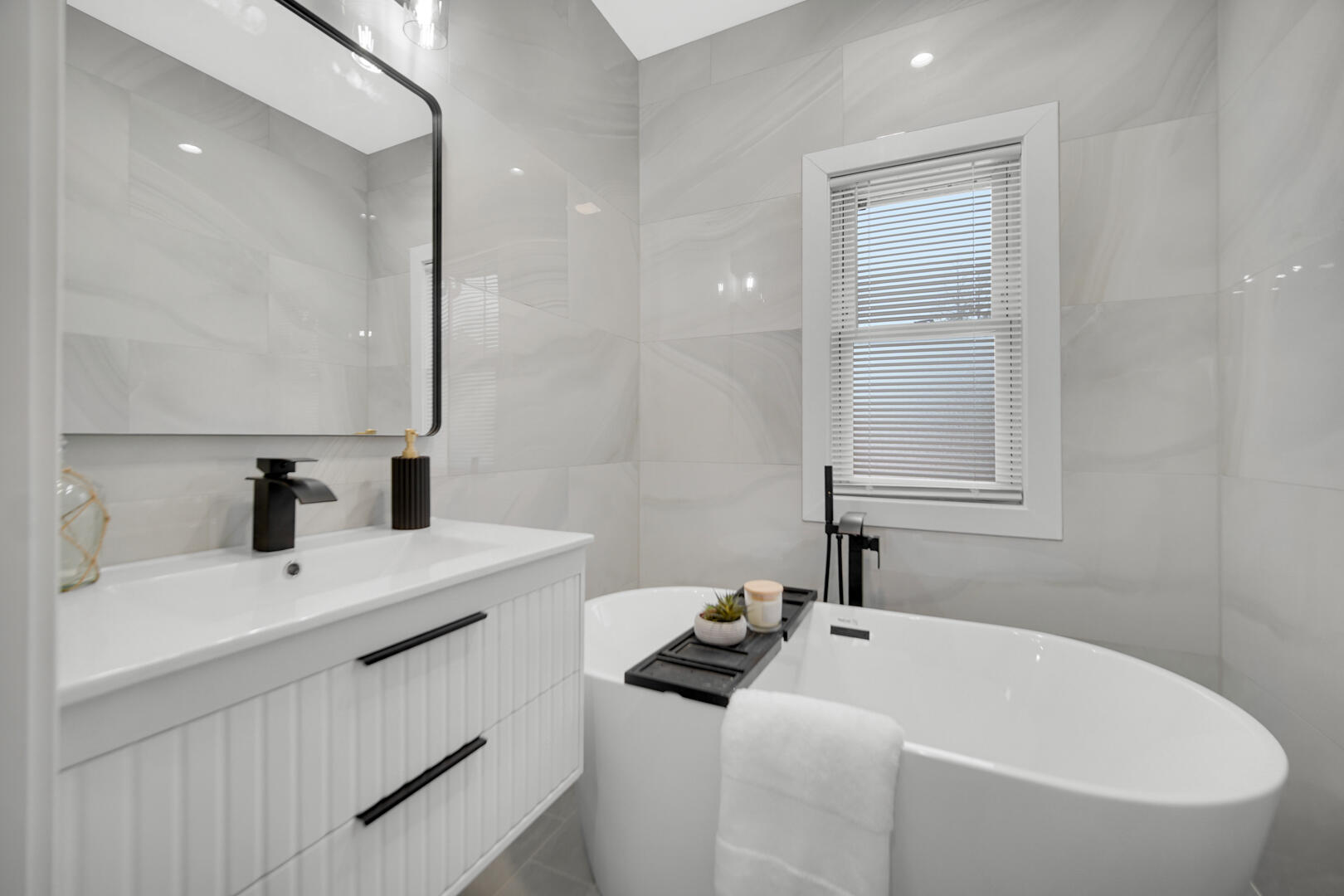 4354 Washington Street Gary, IN 46408 - Photo 19 of 32 a bathroom with a sink and a mirror