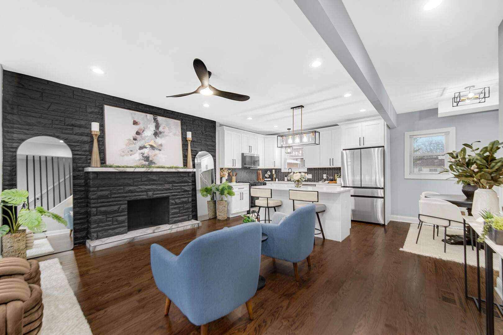 4354 Washington Street Gary, IN 46408 - Photo 6 of 32 a living room with furniture kitchen view and a fireplace