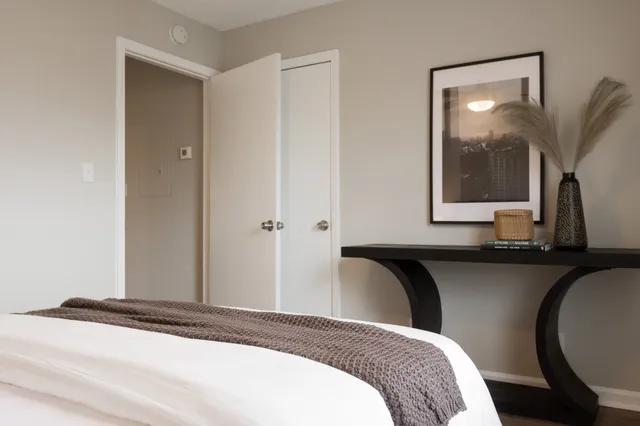 a bedroom with bed and window