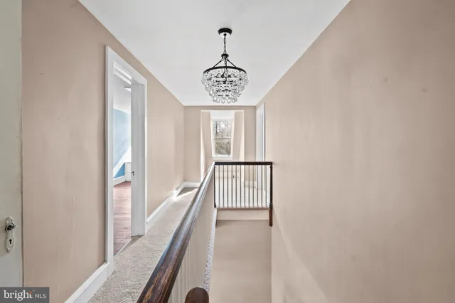 a view of a hallway with windows