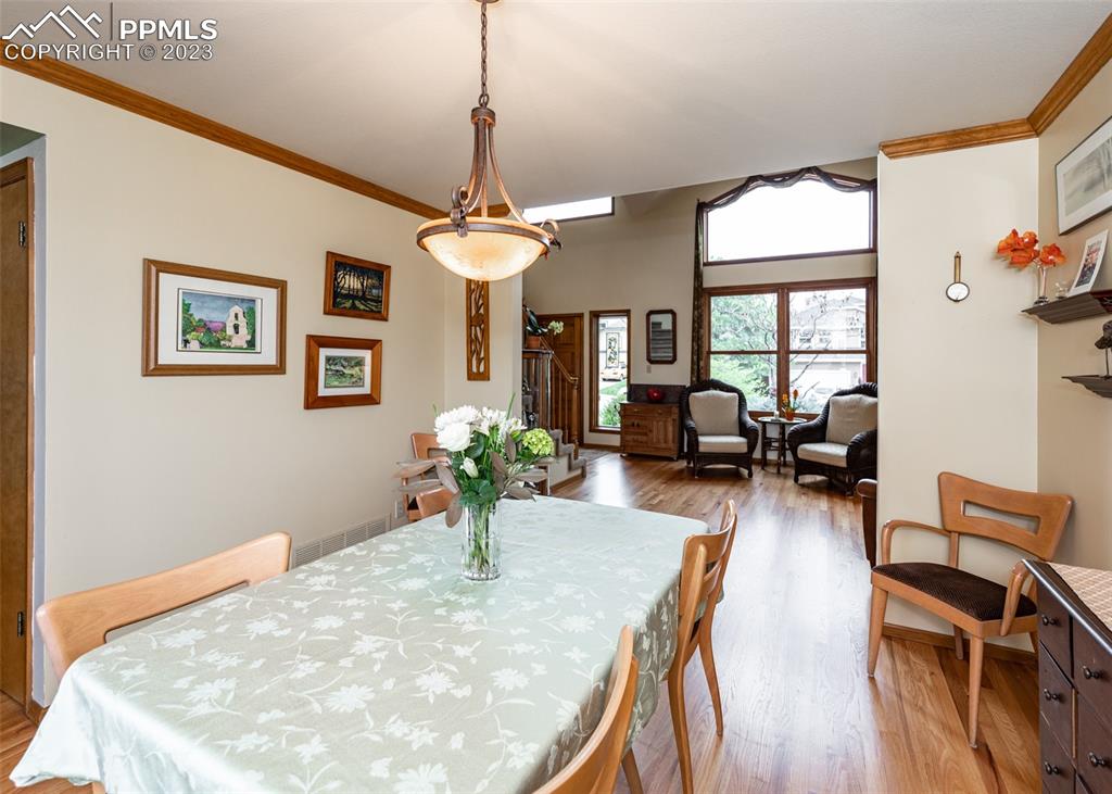 2145 Wickes Road Colorado Springs, CO 80919 - Photo 11 of 50 a view of a livingroom with furniture and a chandelier