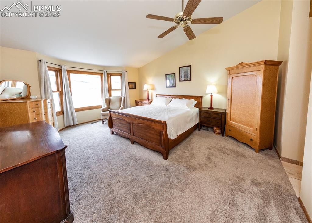 2145 Wickes Road Colorado Springs, CO 80919 - Photo 24 of 50 a spacious bedroom with a bed and a window