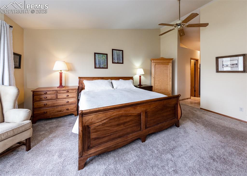 2145 Wickes Road Colorado Springs, CO 80919 - Photo 25 of 50 a bedroom with a bed dresser and a window