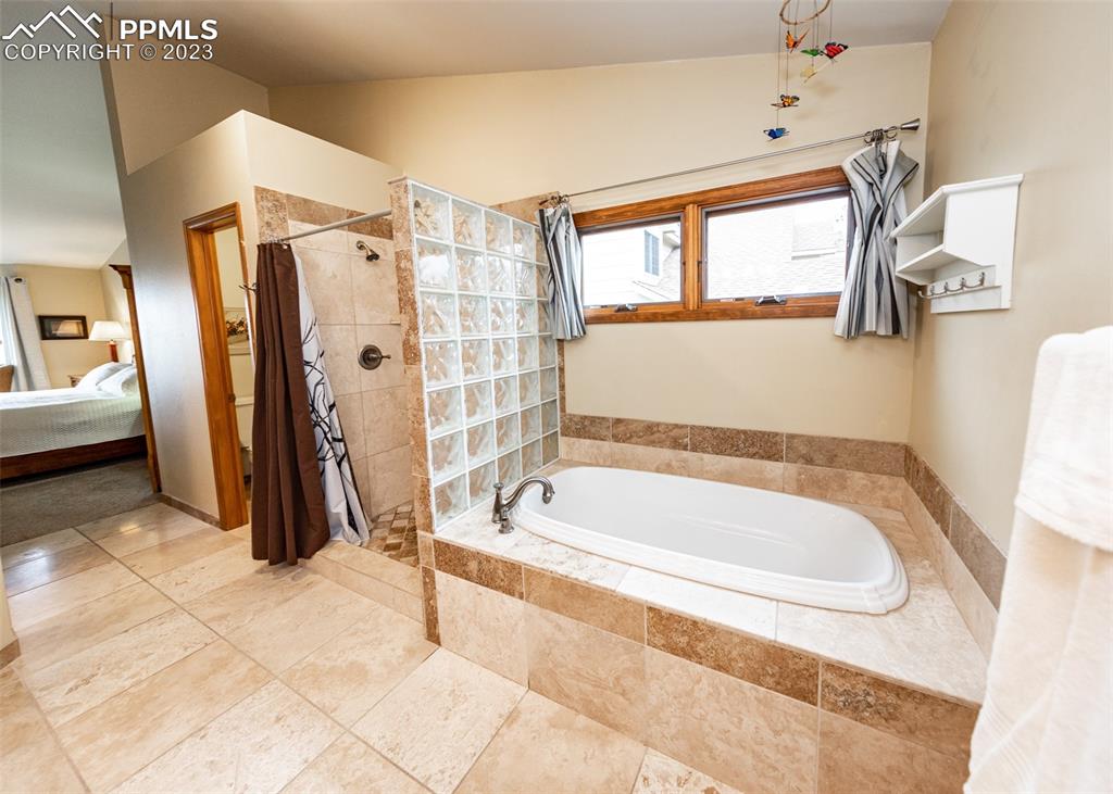 2145 Wickes Road Colorado Springs, CO 80919 - Photo 27 of 50 a spacious bathroom with a tub and a shower