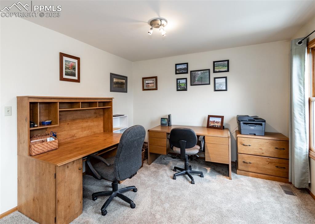 2145 Wickes Road Colorado Springs, CO 80919 - Photo 28 of 50 a view of a workspace with furniture