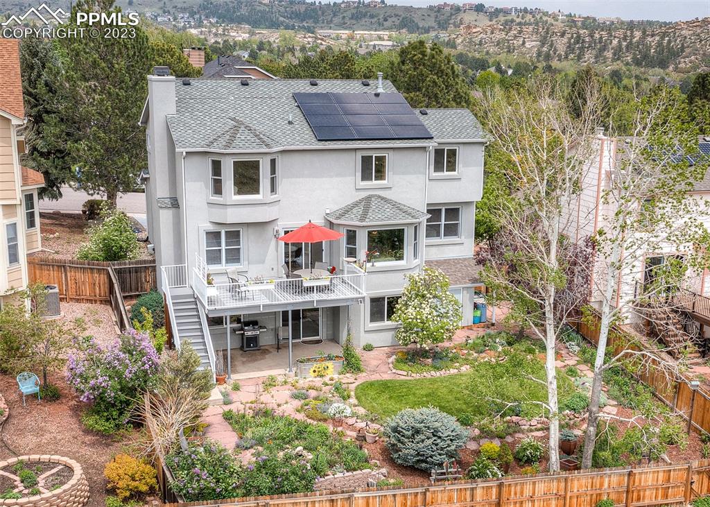 2145 Wickes Road Colorado Springs, CO 80919 - Photo 3 of 50 a aerial view of a house with table and chairs