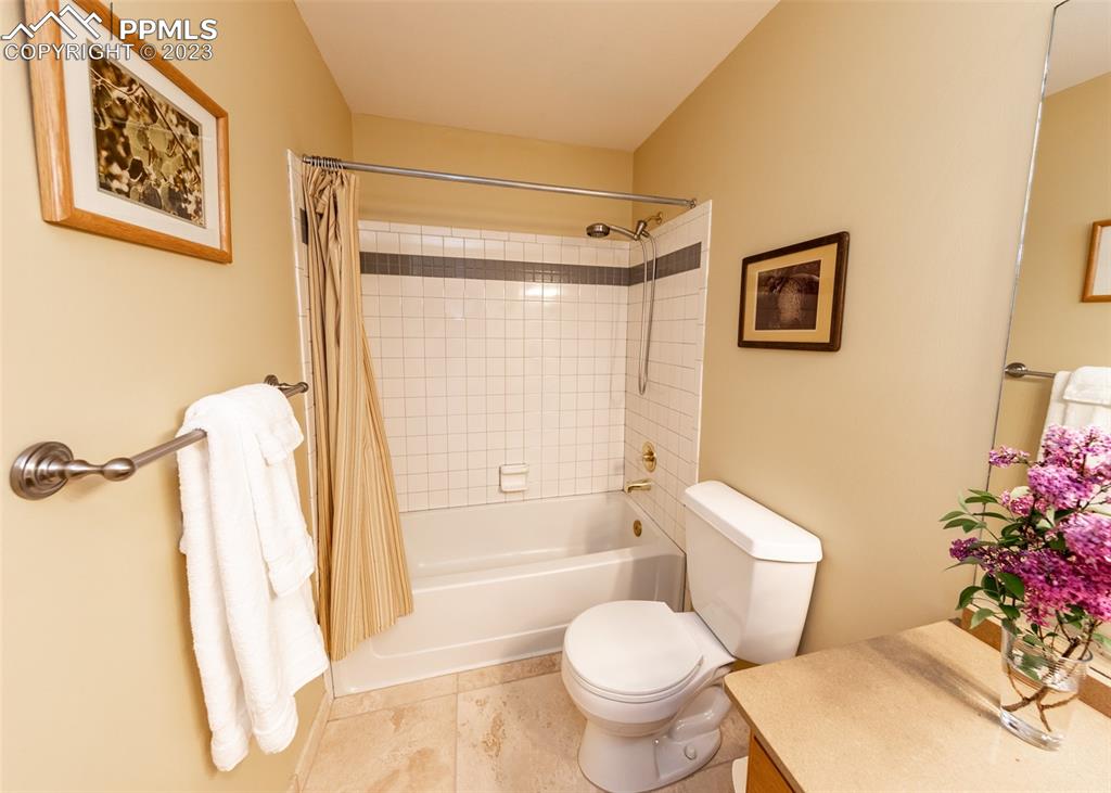 2145 Wickes Road Colorado Springs, CO 80919 - Photo 32 of 50 a white toilet sitting next to a bath tub shower