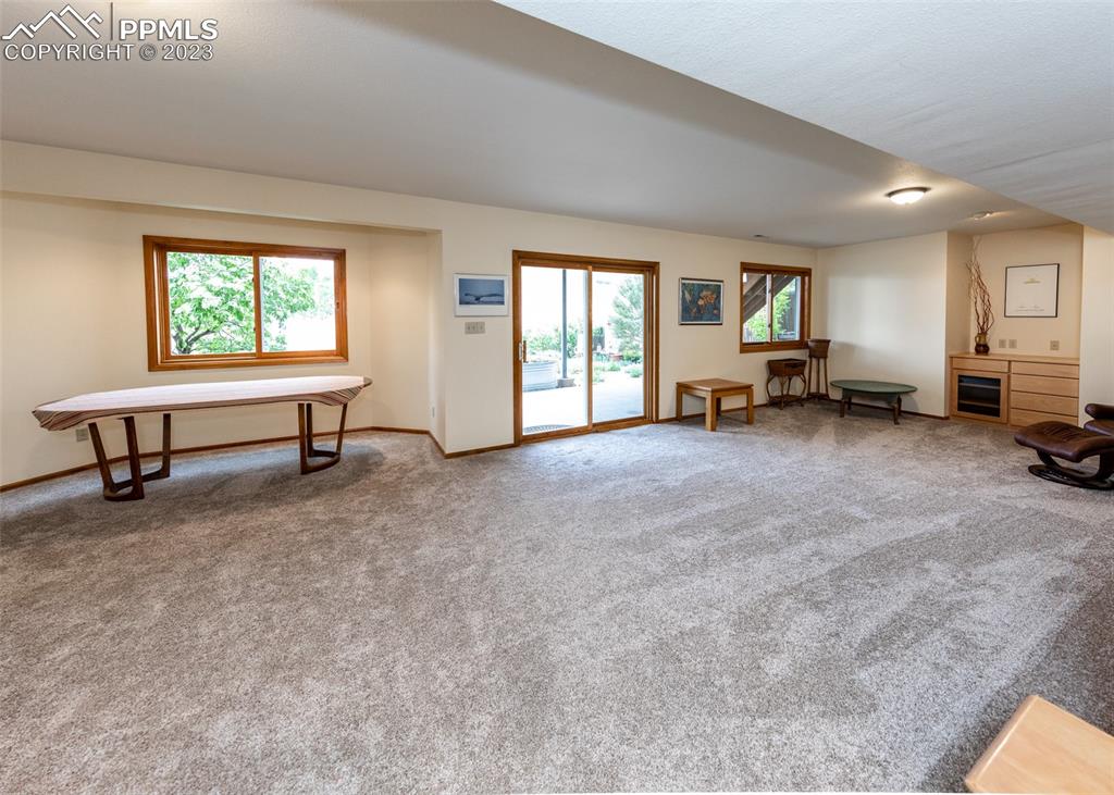 2145 Wickes Road Colorado Springs, CO 80919 - Photo 34 of 50 a view of a livingroom with furniture and a window