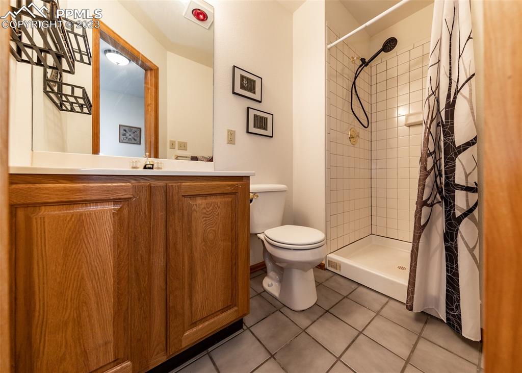 2145 Wickes Road Colorado Springs, CO 80919 - Photo 38 of 50 a bathroom with a toilet sink and shower